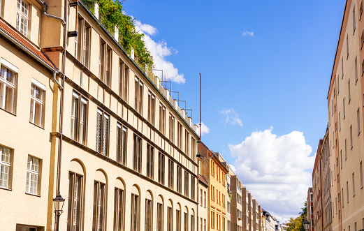 A view down a residential street in the east of Berlin on a sunny day in September.