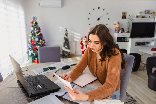 istock Woman Deep in Exam Prep at Home 1904132176