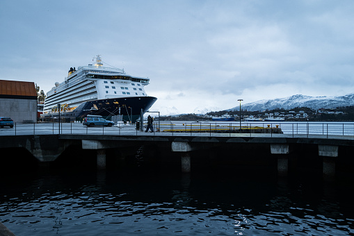 Alesund, Norway - November 1, 2023: Winter city scapes on November 1, 2023 in Alesund, Norway. City life in Alesund, with cruise ship at the harbor in winter