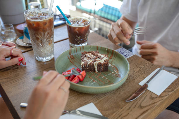istock Peoples are eating chocolate brownie. 1904149747