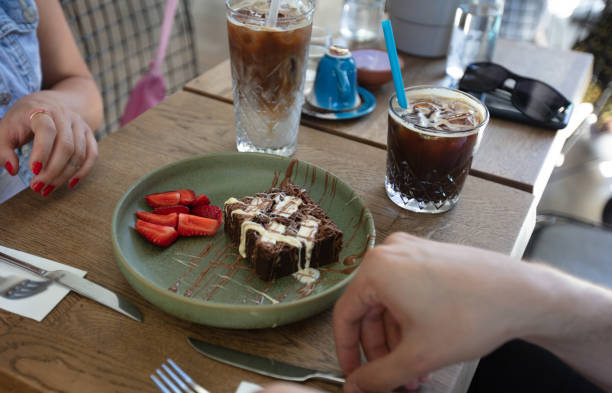 istock Peoples are eating chocolate brownie. 1904150271
