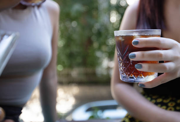 istock A woman is drinking a cold brew coffee. 1904152354