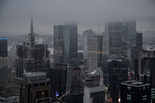 Scyscrapers literally scraping the clouds in New York City.