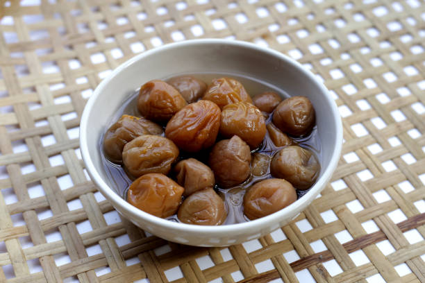 istock Pickled plums in white bowl 1904180077