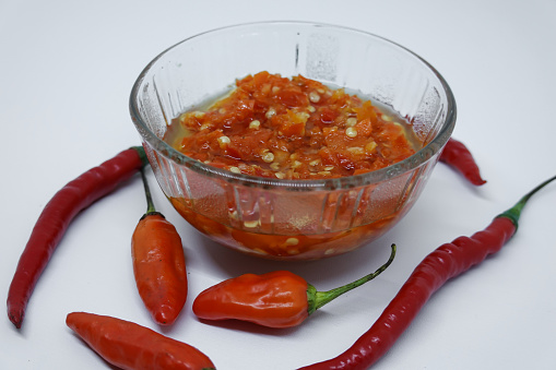 Very spicy chili sauce made from selected fresh chilies served in a glass bowl.