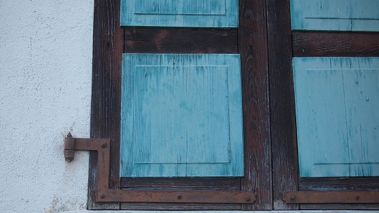 Old natural wood shutters in retro style, France, Morzine