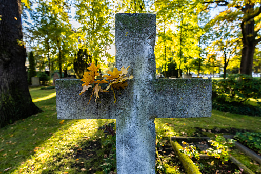 Cemetery cross with sun