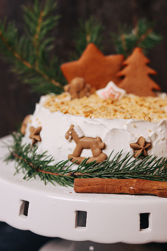 Festive Christmas cake decorated with spiced Christmas gingerbread cookies