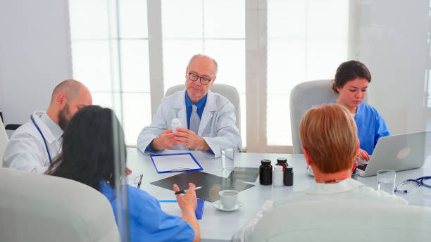 istock Concentrated medical team discussing looking for solutions together 1904299425