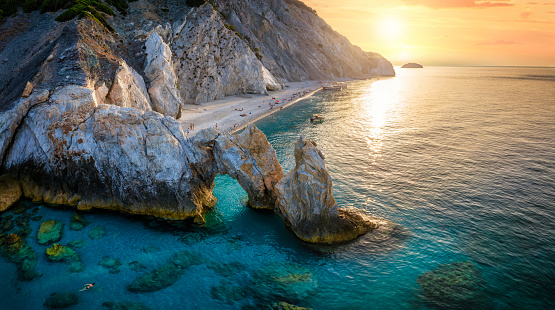 Aerial view of the beautiful Lalaria beach at Skiathos Island, Sporades, Greece, during golden summer sunset time
