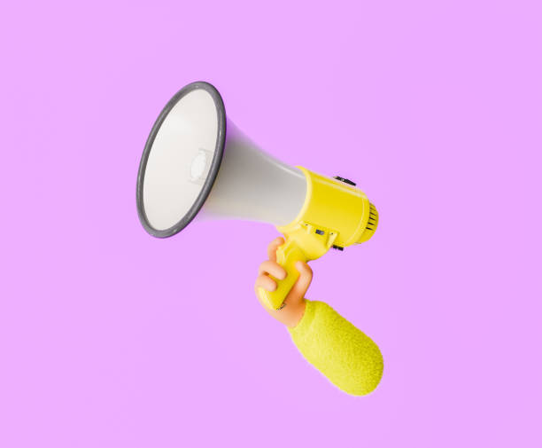 istock Hand Holding Yellow Megaphone on Purple Background 1904395262