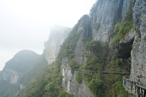 There is a path on the bare mountain wall. Characteristics of karst landforms. Jinfo Mountain karst topography, biodiversity and Buddhist culture, Chongging.