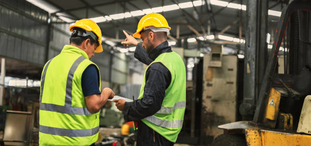 istock two engineer look projects and planning with tablet mobile in factory 1904504210