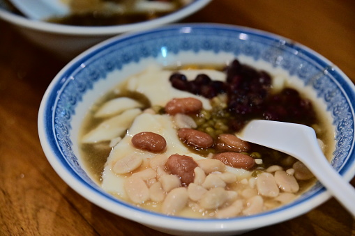 Tofu pudding (aka soybean pudding or soft tofu) is a very popular snack in Taiwan. If always eat with red bean, peanut, or tapioca ball on the topping. Of course, there are tons of dressings to choose