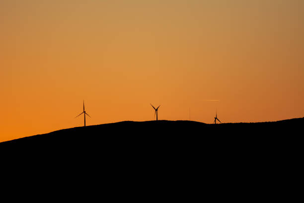 Three windmills of modern technology on the horizon of Dinarides