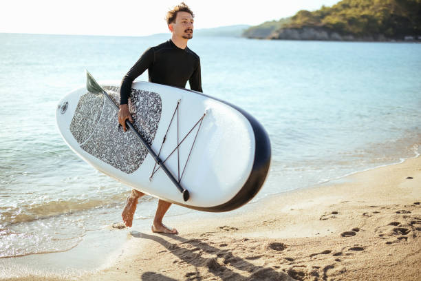 istock Man comes out of the water 1904526490