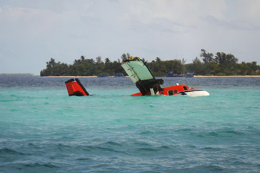 Seaplane while landing in Bad Weather Touched a piece of Coral Reef and Crashed in Sea in front of an Island resort, Nobody were Injured but the Plane was Submerged and faced serious Technical Damage