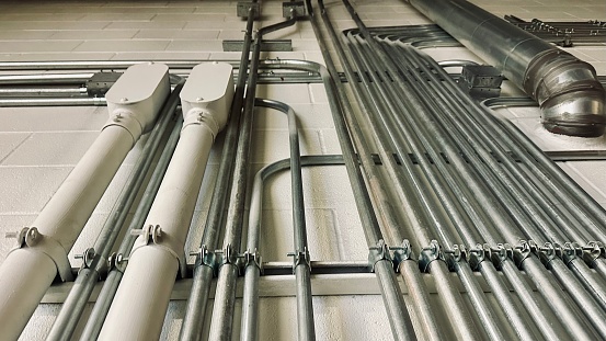 Installation of Electrical metallic conduits on the wall