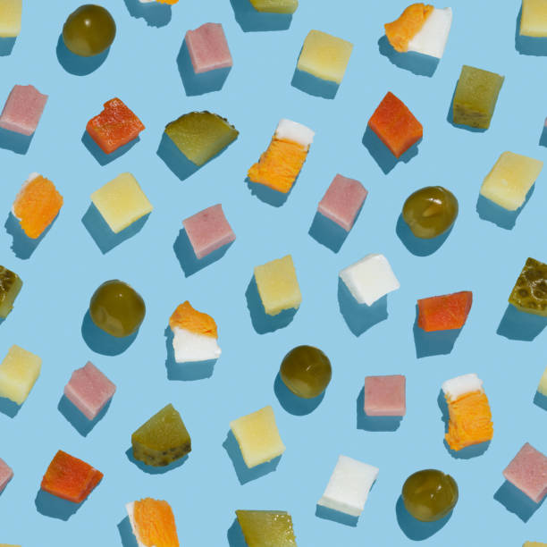 istock Seamless pattern of Olivier salad ingredients on blue background 1904577465