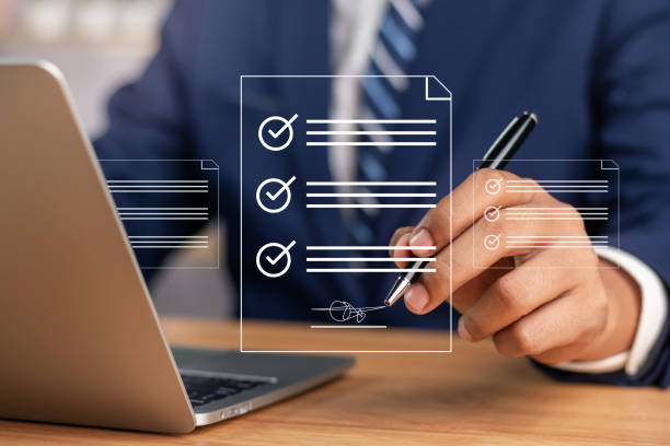 istock Efficient Electronic Signature Concept, Businessman using stylus pen signs electronic documents on digital documents on virtual tablet. Signing electronic documents for paperless transactions. 1904589035