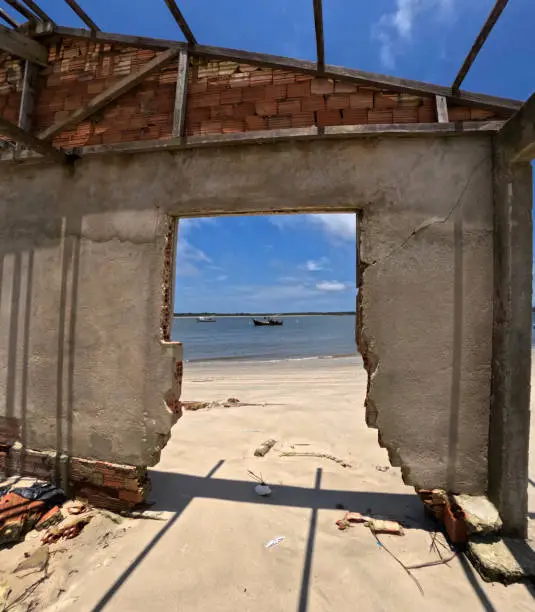 Ruins of an old house hit by the tide in the fishing village of Superagui on the south coast of Brazil