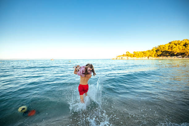 istock Happy couple having fun and love on the beach 1904601158