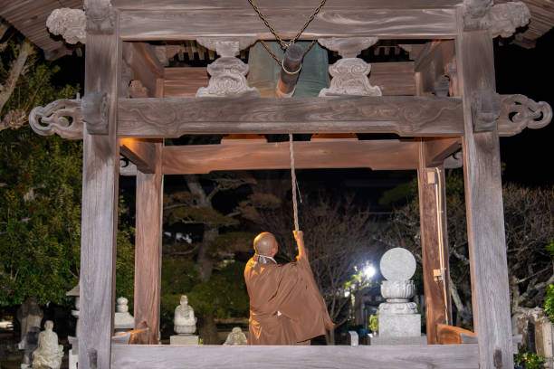 istock A monk ringing a bell to celebrate the new year 1904607408