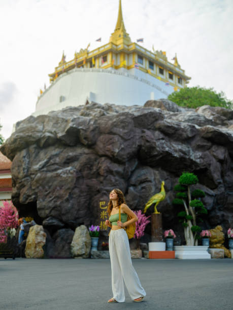 istock Woman exploring temple in Bangkok during her vacation 1904624673