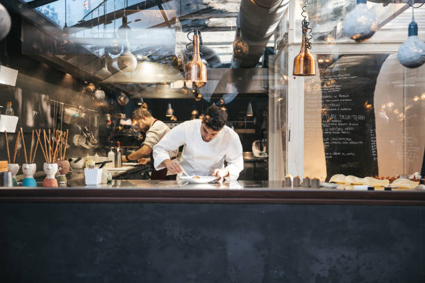 istock A chef is cooking in his restaurant's kitchen 1904635723