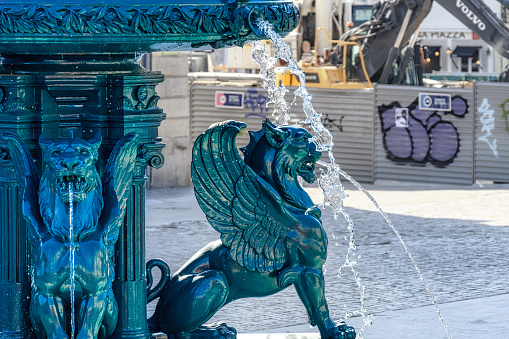 Porto, Portugal - Feb. 16, 2023: Flowing water in the Fountain of the Lions. Located in the old town, the place is a tourist attraction.