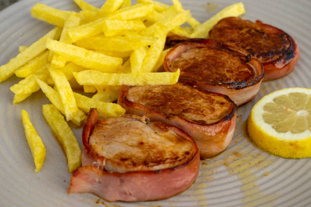 pork tenderloin wrapped in bacon. - steak plate gourmet beef imagens e fotografias de stock