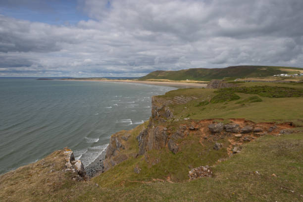 Summer landscape on Worm s Head and Rhosilli Bay in Wales
