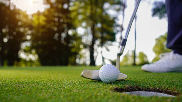 istock golfer playing golf in beautiful golf course in the evening golf course with sunshine 1904674816