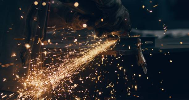 istock Grinding Metal Sparks Steel Cutting At Industrial Workshop 1904686392