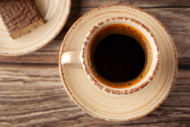 istock Cup of hot aromatic coffee with sweets on the table 1904698432