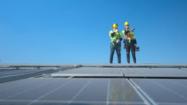 istock Both of technician working on a photovoltaic solar panels 1904730788