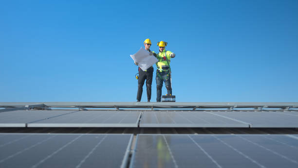 istock Both of technician working on a photovoltaic solar panels 1904730792