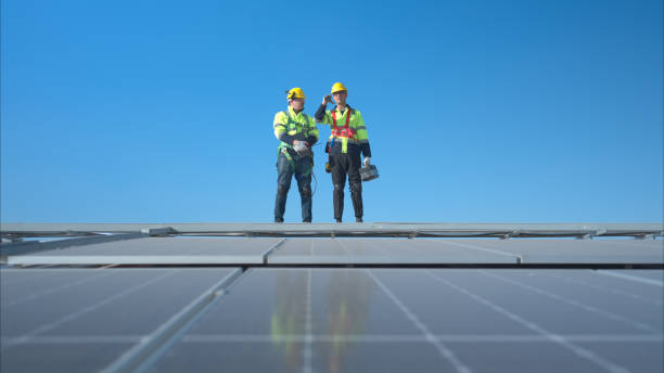 istock Both of technician working on a photovoltaic solar panels 1904731310