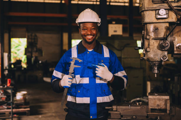 istock Production engineers are assisting adjusting and maintaining factory machine, Male workers technician examining control the industrial technology tool, professional repair men work in industry plant 1904743999
