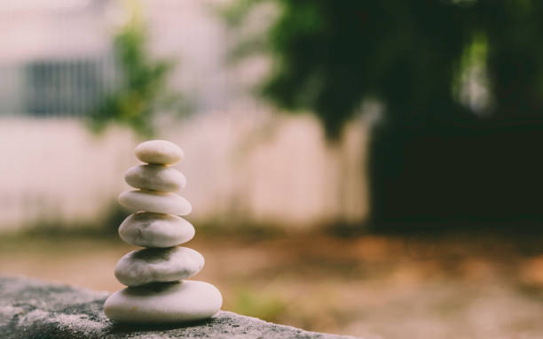 istock Build pebble stack on the sea shore on hand copy space and natural pebble stone beautiful. Concentration, balanced body, spirit, soul and relaxation concept. 1904787856