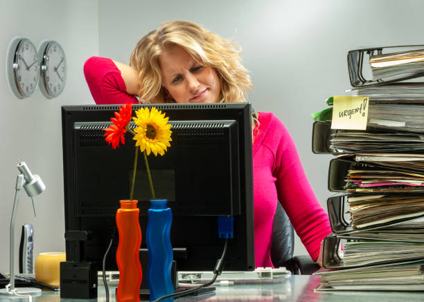 istock Studioshot of Young woman in office working late. 1904826176
