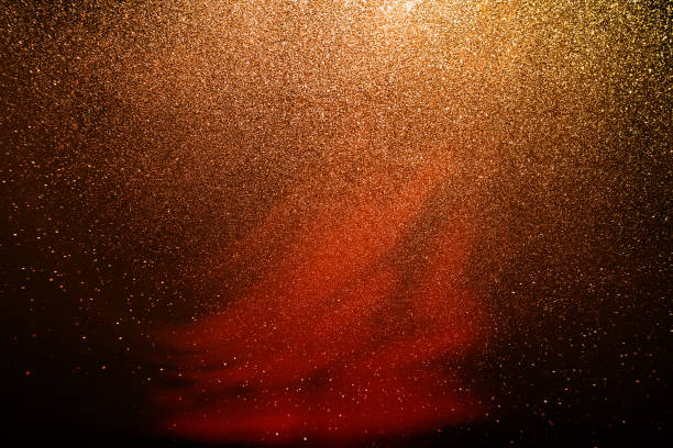 istock golden black glitter texture abstract banner background with space. Twinkling glow stars effect. Like outer space, night sky, universe. Rusty, rough surface, grain. 1904829363