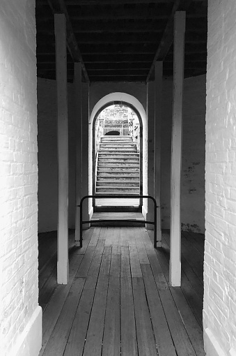 black-and-white shot of a small entrance to wornout stairs in rural Australia