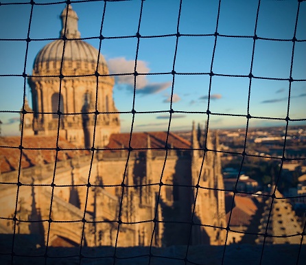 Looking through a net at Spain’s beautiful brick-adorned skyline