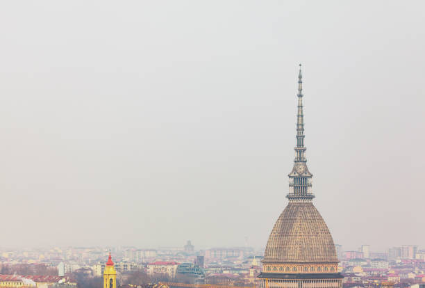 Turin is the capital of Piedmont and is known for its refined architecture and cuisine. The Alps rise to the northwest of the city. Magnificent baroque buildings and historic cafés line Turin's avenues and grand squares, such as Piazza Castello and Piazza San Carlo. Nearby stands the tall spire of the 19th-century Mole Antonelliana, home to the interactive exhibitions of the National Cinema Museum.