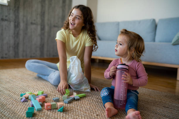 istock Children playing on carpet floor at home 1904887677