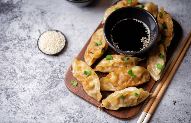 istock Dumplings with soy sauce in a plate 1904892520