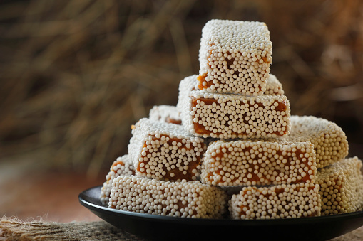 Bal Mithai is a sweet dish from the state of Uttarakhand in northern India. It is made from roasted khoya (reduced milk) and coated with white sugar balls known as \