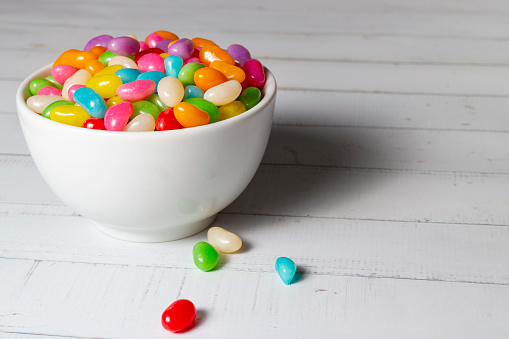 Coloureds jelly beans in a bowl on the table.