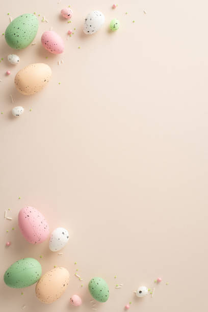 istock Spring Celebration Arrangement: Overhead vertical shot of vibrant Easter eggs and sugar sprinkles confetti on a soft pastel backdropâideal for greeting text or advertisements 1904963122